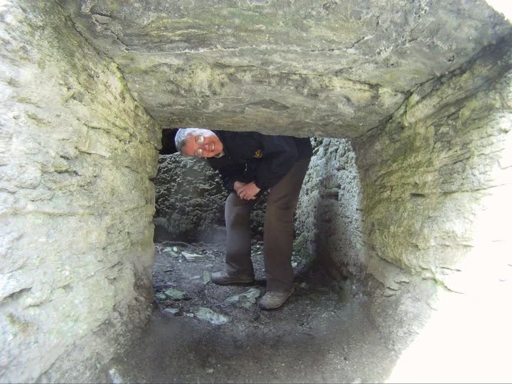Man crouches to look underneath the Mona Erin Wheelcase in Glen Maye